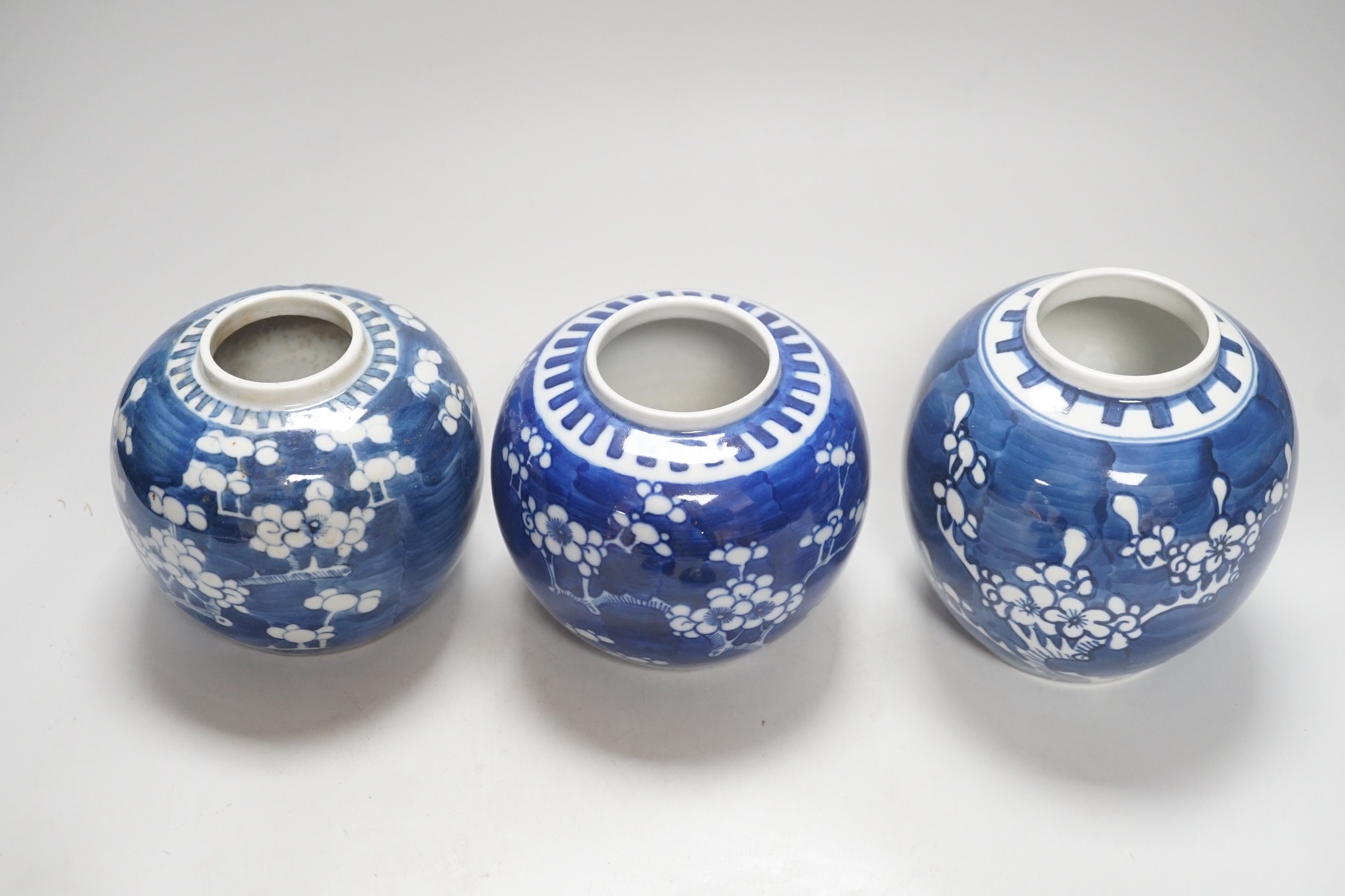 Three Chinese blue and white prunus jars, late 19th / early 20th century, tallest 16cm